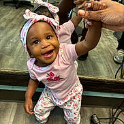Nature is registered to the contest to win money with this photo: adult_hand, baby, cables, child, cute, floor, floral_pattern, happy, headband, holding_hands, indoor, mirror, person, pink_clothing, portrait, reflection, smiling, socks, toddler, wooden_floor