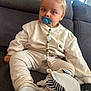 Sandro participe au concours pour gagner de l'argent avec cette photo : toddler, pacifier, child, sitting, couch, clothing, indoor, blond_hair, blue_eyes, comfort, soft_toys, beige, white_socks, striped_fabric, home, cute, portrait, baby_accessory, relaxed, young_child