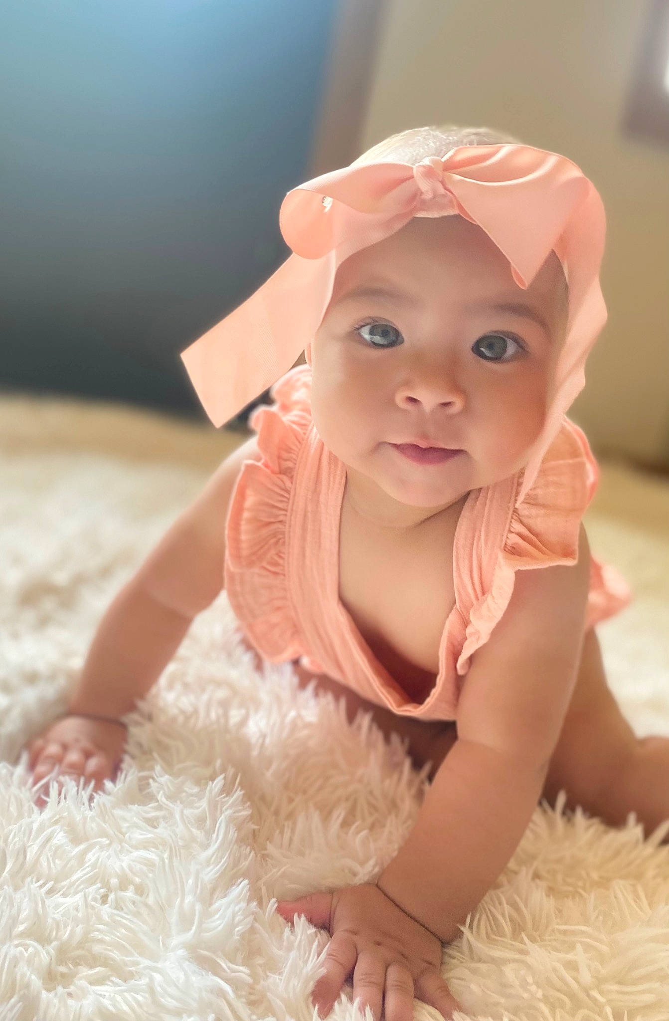 Aliana is registered to the contest to win money with this photo: baby, baby_toddler_clothing, bridal_accessory, cap, child, doll, dress, fashion_accessory, flooring, fun, hair_accessory, happy, headpiece, headwear, jewellery, peach, person, pink, sitting, skin
