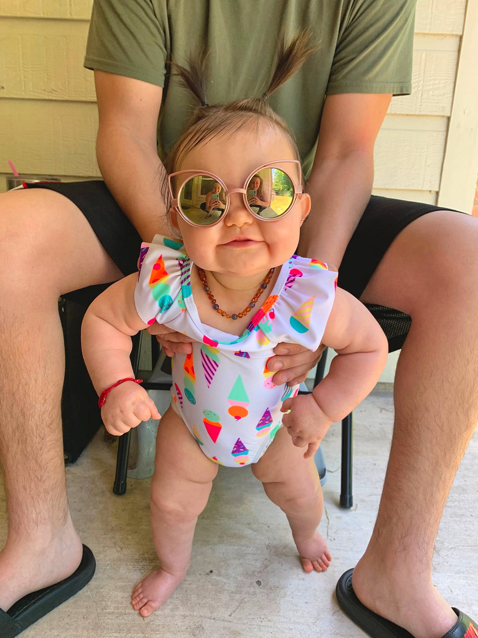 Ensley joined the competition — help win amazing prizes! arm, child, eyewear, fun, glasses, human_leg, leg, person, personal_protective_equipment, play, sitting, sunglasses, thigh, toddler, vacation
