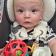 Thomas joined the competition — help win amazing prizes! baby, blanket, car_seat, child, clothing, colorful, comfort, curly_hair, cute, expression, eyes, fabric, face, hand, indoor, infant, person, portrait, seatbelt, toy