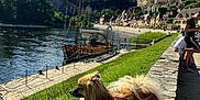 Skouby a rejoint le concours — aidez-le/la à gagner de superbes lots ! boat, cloud, dog, grass, harness, hill, leash, nature, outdoor, person, river, sky, stone, summer, sunlight, travel, tree, village, walking, water