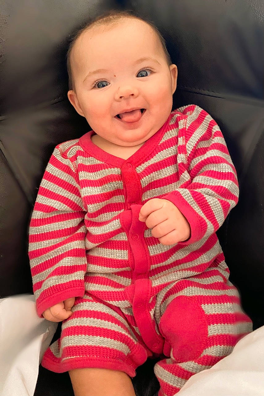 Eliza joined the competition — help win amazing prizes! baby, baby_toddler_clothing, cheek, child, comfort, face, facial_expression, finger, gesture, happy, human_body, joy, lip, nose, person, pink, product, skin, sleeve, smile