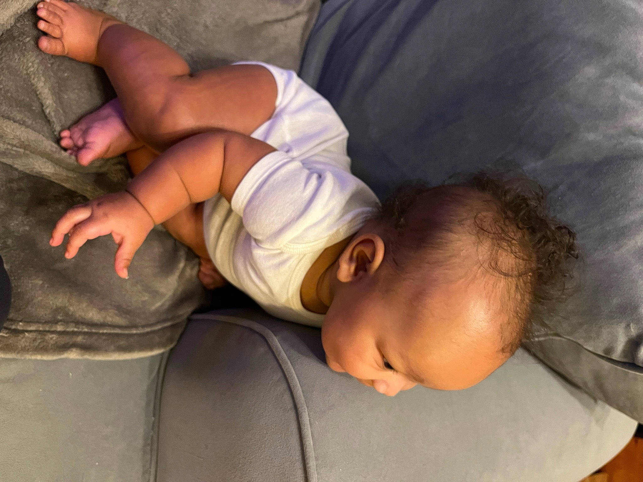 Alaia joined the competition — help win amazing prizes! abdomen, black_hair, child, comfort, elbow, fun, gesture, glasses, hairstyle, human_leg, joint, knee, linens, mouth, nap, person, sitting, skin, thigh, toddler