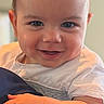 Easton Hanrahn joined the competition — help win amazing prizes! baby, infant, smiling, face, hands, cushion, white_clothing, portrait, closeup, cute, child, young, skin, expression, indoor, person, head, eyes, happy, light