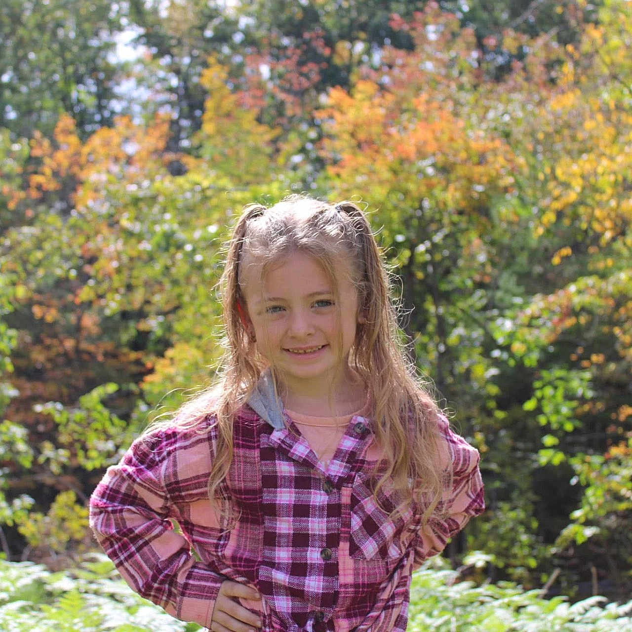 Layla is registered to the contest to win money with this photo: blonde, blouse, clothing, face, grass, hair, head, herbal, herbs, land, nature, outdoors, person, photography, plant, portrait, shirt, tree, vegetation, woodland