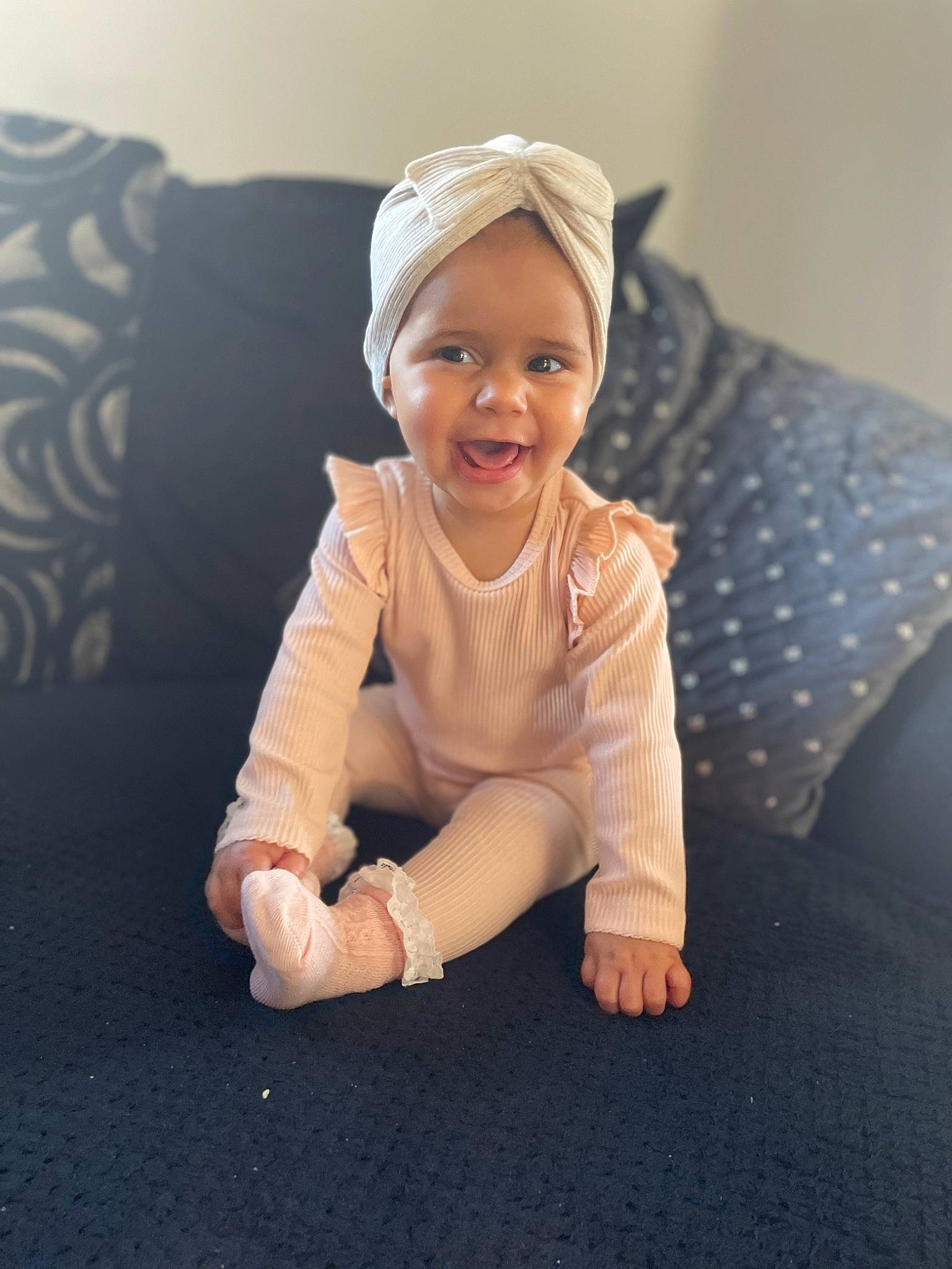 Giana joined the competition — help win amazing prizes! arm, baby, baby_laughing, baby_toddler_clothing, comfort, eye, flash_photography, floor, flooring, foot, gesture, happy, human_body, human_leg, knee, leg, person, sleeve, smile, thumb