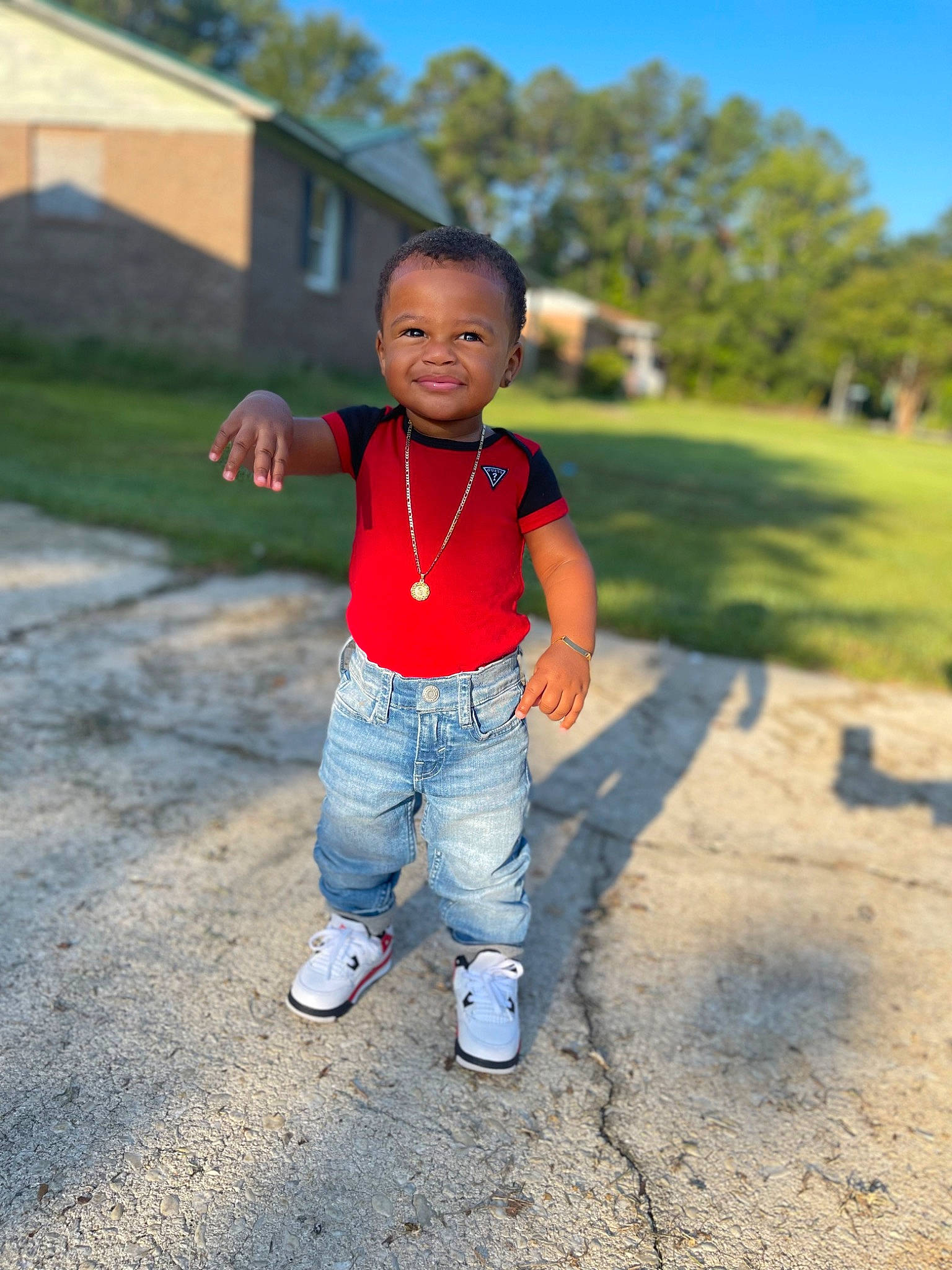 Sevyn is registered to the contest to win money with this photo: asphalt, cool, electric_blue, flash_photography, fun, gesture, grass, happy, jeans, joy, landscape, leg, leisure, people_in_nature, person, plant, sky, smile, standing, t_shirt