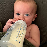 Oliver joined the competition — help win amazing prizes! baby, blanket, blue_eyes, bottle, close_up, cute, face, feeding, hand, indoors, infant, milk, nourishment, person, portrait, relaxation, sitting, skin, soft_texture, young_child