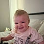 Kaiden joined the competition — help win amazing prizes! baby, child, smiling, shirt, indoors, bed, pillow, clothing, clip, happy, face, person, blurred, home, young_child, infant, seated, cute, light, background