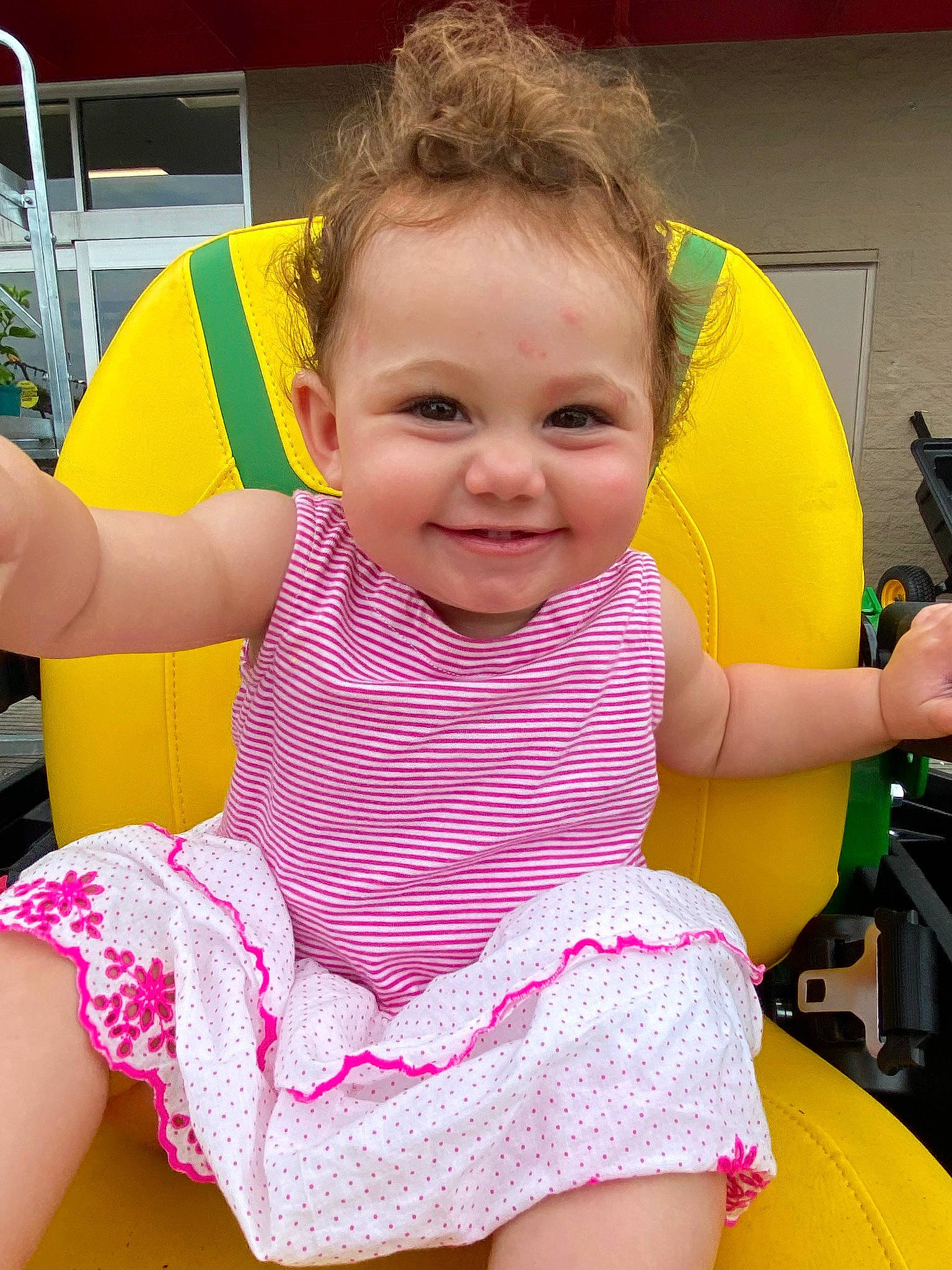 Magnolia is registered to the contest to win money with this photo: baby_toddler_clothing, beauty, chair, cheek, child, event, facial_expression, fun, happy, human_leg, joy, lap, leisure, magenta, mouth, person, pink, skin, smile, thigh