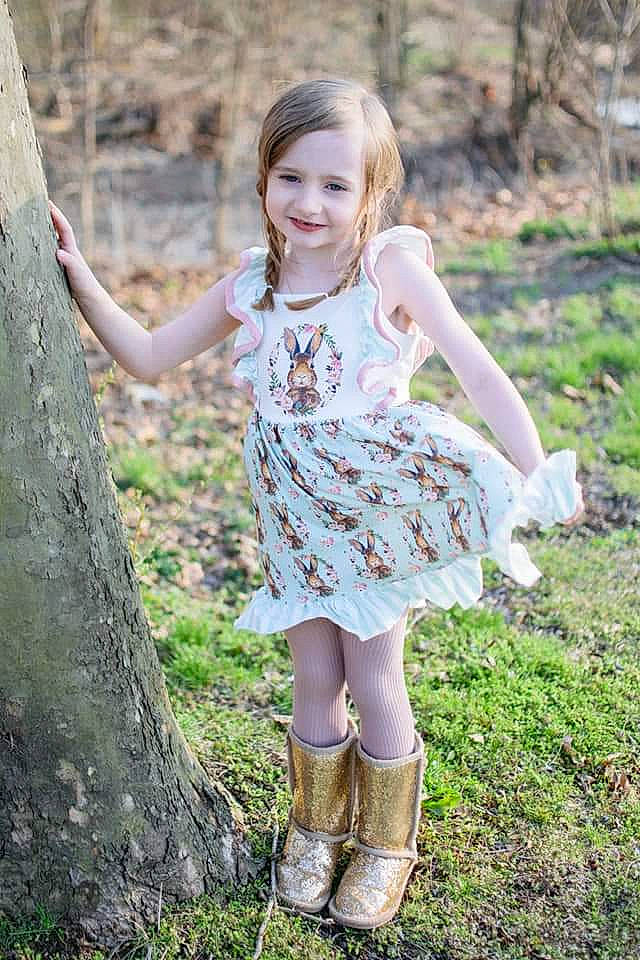 Arabelle joined the competition — help win amazing prizes! eye, face, facial_expression, fawn, grass, hair, happy, head, human_body, joy, knee, leaf, long_hair, natural_environment, nature, people_in_nature, person, pink, plant, smile