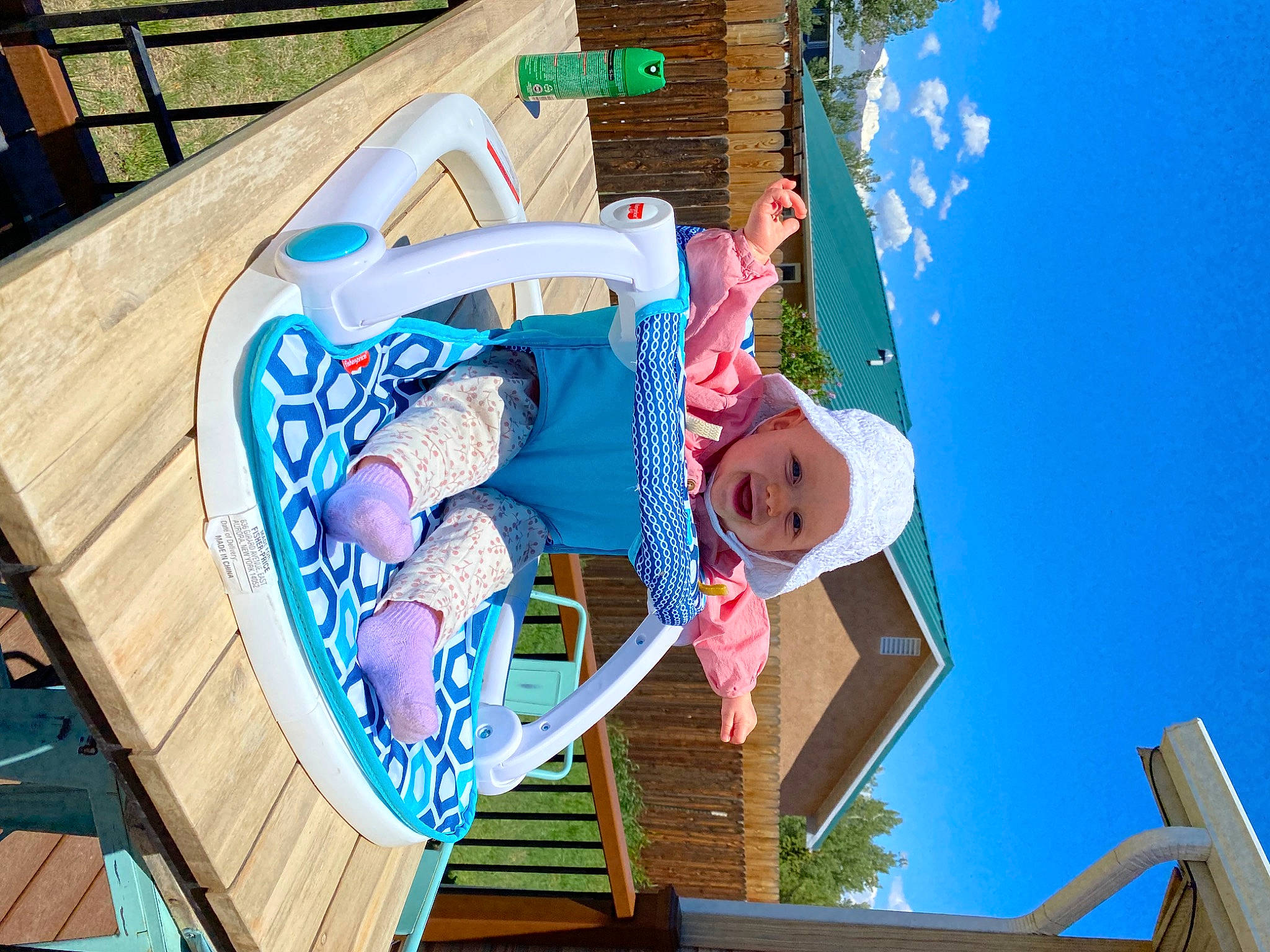 Karlee is registered to the contest to win money with this photo: baby, blue, building, child, event, fun, happy, hat, headwear, house, leisure, outdoor_furniture, person, recreation, room, shorts, sky, smile, toddler, vacation