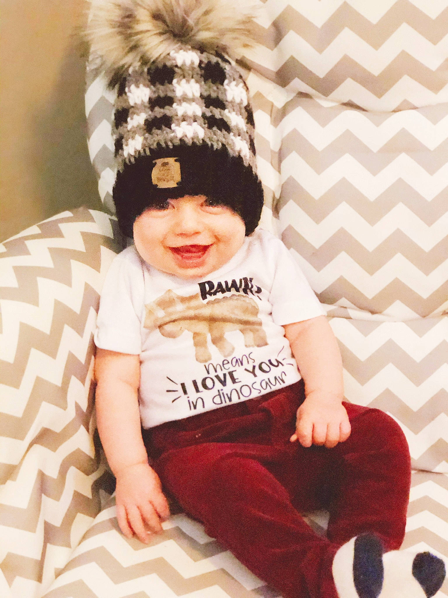 Hollis is registered to the contest to win money with this photo: baby, baby_toddler_clothing, beanie, bonnet, cap, child, clothing, cool, design, ear, fashion_accessory, fur, headgear, joy, knit_cap, outerwear, pattern, person, sleeve, toddler