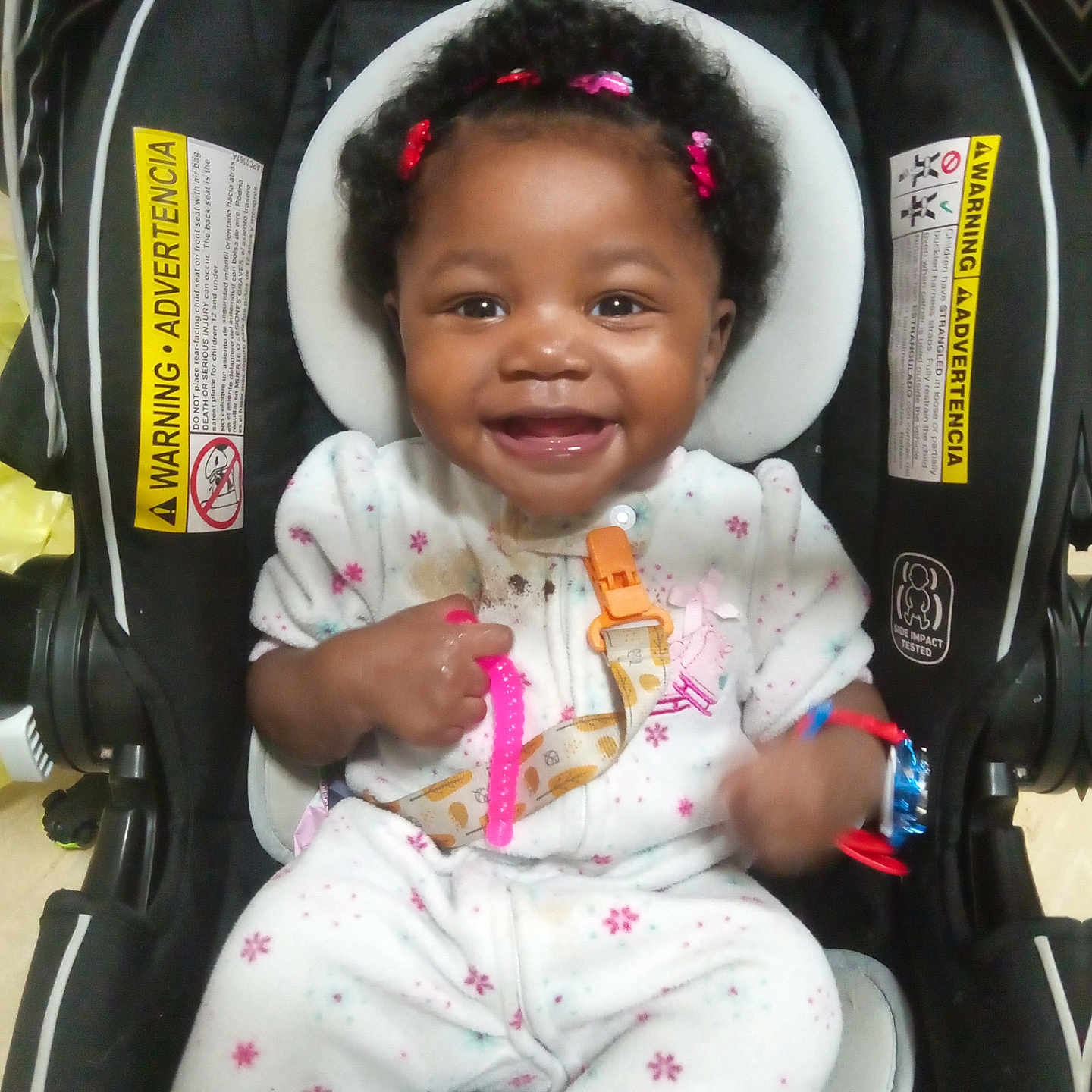 Paris joined the competition — help win amazing prizes! baby, bonnet, car, car_interior, carseat, clothing, cutlery, face, happy, hat, head, laughing, person, photography, portrait, smile, spoon, stroller, transportation, vehicle