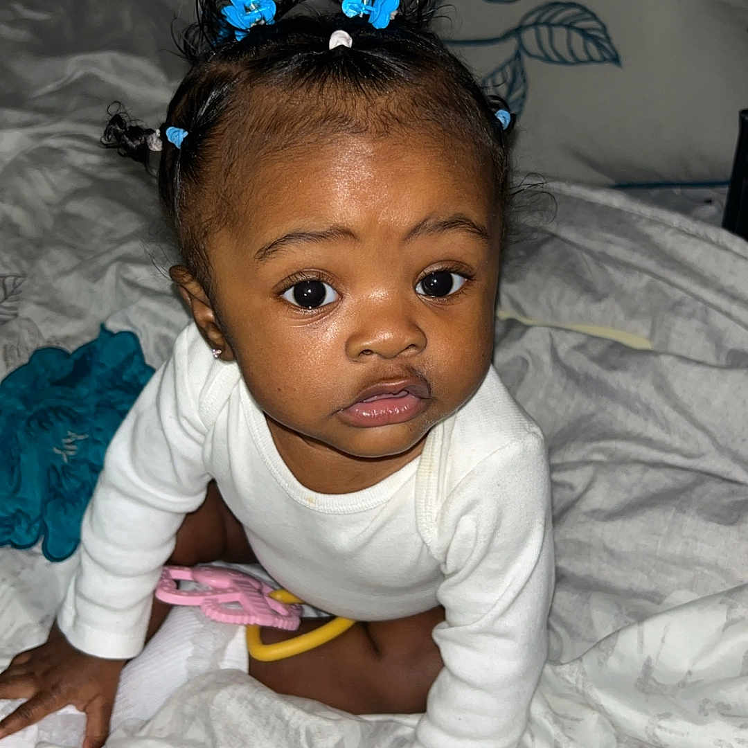 Bryelle is registered to the contest to win money with this photo: accessories, baby, babycrawling, back, bed, bedroom, bodypart, crawling, cushion, face, finger, furniture, hand, head, homedecor, indoors, person, photography, portrait, room