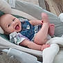 baby, infant, smiling, denim, romper, baby_seat, blanket, carpet, happy, cute, child, indoor, playful, legs, hand, clothing, face, person, cozy, home