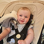 Oaklee joined the competition — help win amazing prizes! baby, smiling, stroller, harness, plush_toy, child, infant, clothing, seat, safety, cute, happy, portrait, indoors, comfort, face, hand, baby_girl, baby_boy, young_child