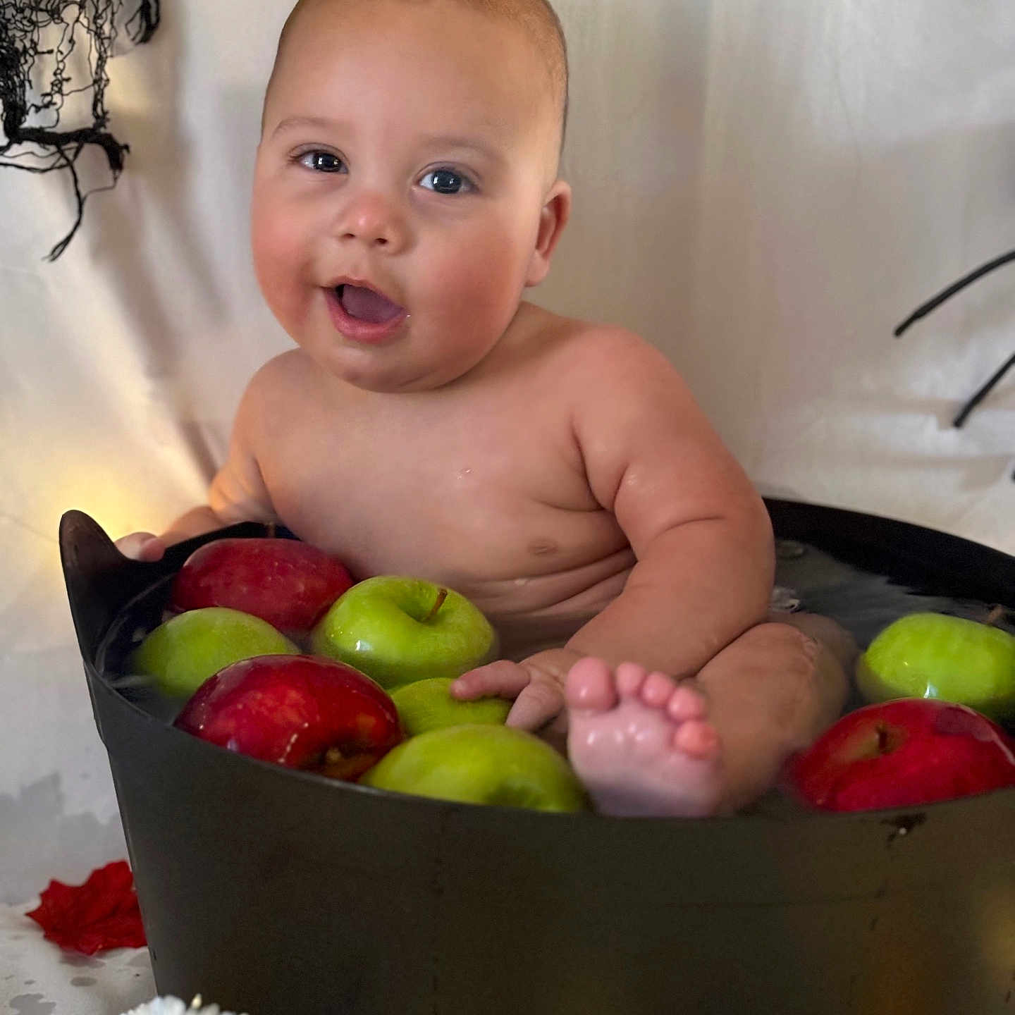 Prince is registered to the contest to win money with this photo: apple, baby, bathing, bathtub, bodypart, eating, face, finger, food, fruit, head, meal, newborn, person, photography, plant, portrait, pottedplant, produce, tub