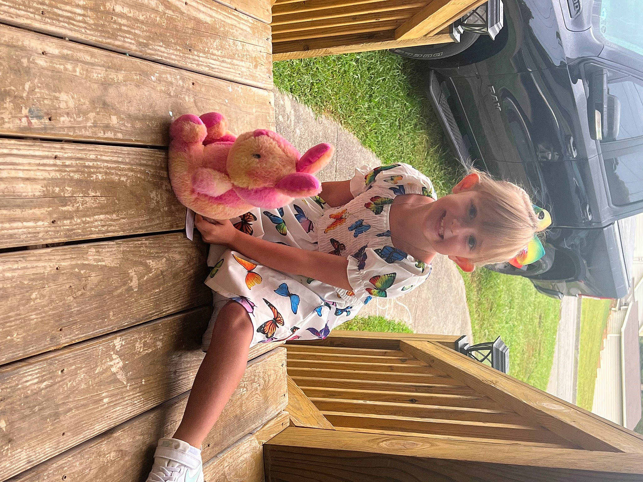 Nila is registered to the contest to win money with this photo: baby, baby_toddler_clothing, calf, car, child, foot, fun, happy, hardwood, human_leg, joy, leisure, pattern, person, plant, play, sandal, stairs, thigh, toddler