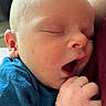 Theodore is registered to the contest to win money with this photo: baby, sleeping, yawning, close_up, infant, hand, face, skin, cozy, blue_clothing, peaceful, newborn, cute, soft_light, portrait, human, child, resting, mouth_open, tiny_fingers