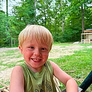 Remi joined the competition — help win amazing prizes! child, boy, blond_hair, smiling, outdoor, forest, greenery, tank_top, wood, nature, happy, face, person, daylight, casual, trees, background, playful, summer, dirt