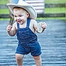 toddler, child, denim_overalls, cowboy_hat, barefoot, outdoor, wooden_deck, american_flag, milestone_card, happy, smiling, walking, baby, summer, cute, portrait, grass, background_blur, playful, person