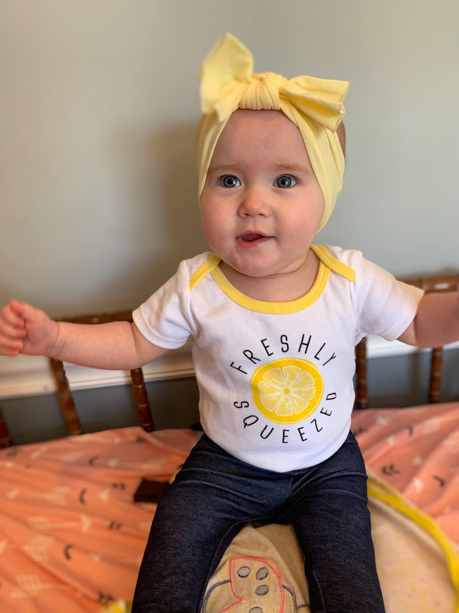 Gemma joined the competition — help win amazing prizes! baby, baby_toddler_clothing, child, child_model, costume, ear, hair_accessory, happy, headband, headgear, headwear, person, sitting, sleeve, t_shirt, toddler, yellow