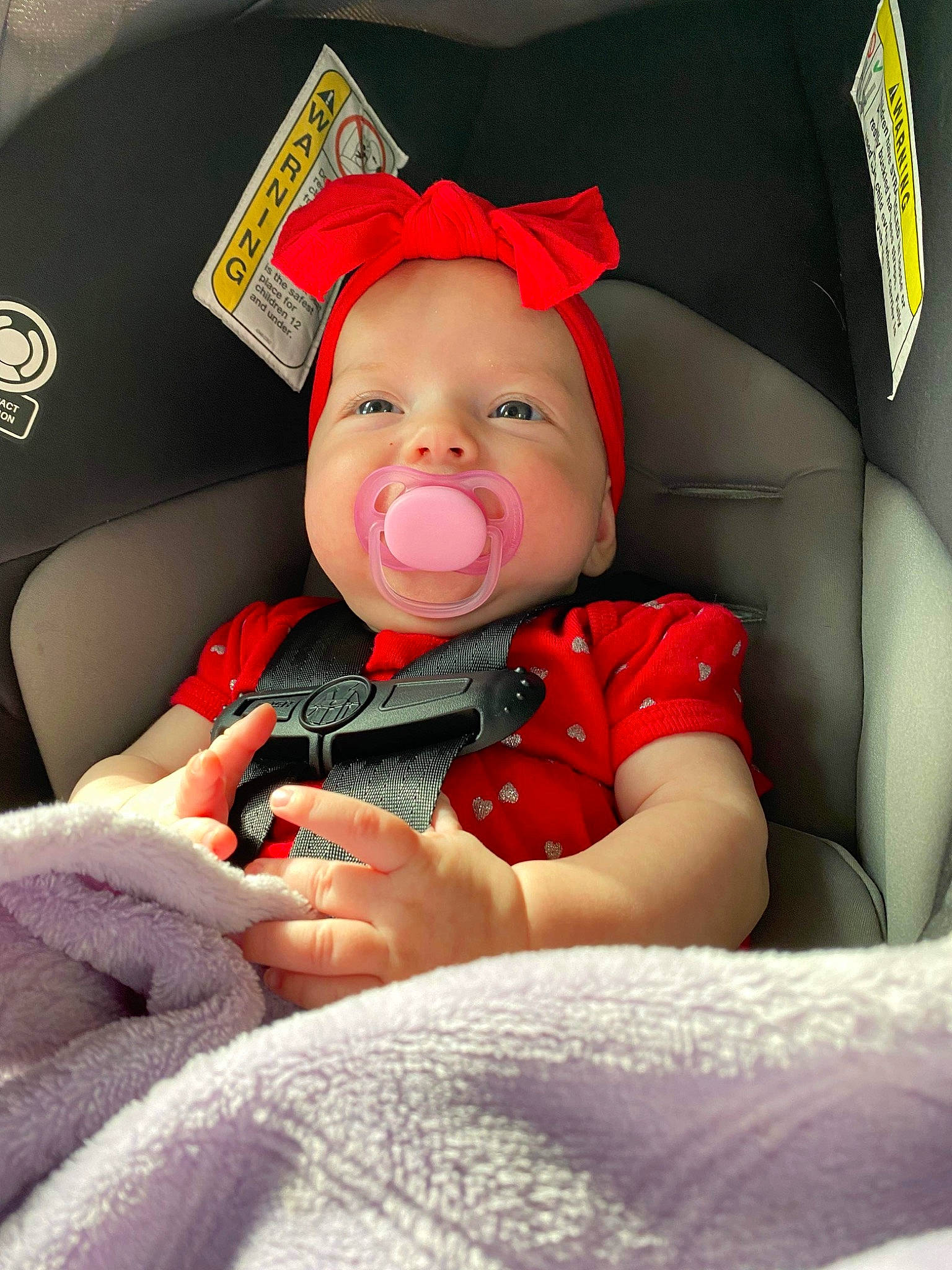 Charleigh is registered to the contest to win money with this photo: auto_part, baby, baby_carriage, baby_in_car_seat, baby_products, baby_safety, baby_sleeping, baby_toddler_clothing, car_seat, carmine, cheek, child, comfort, finger, fun, happy, lap, linens, person, sitting