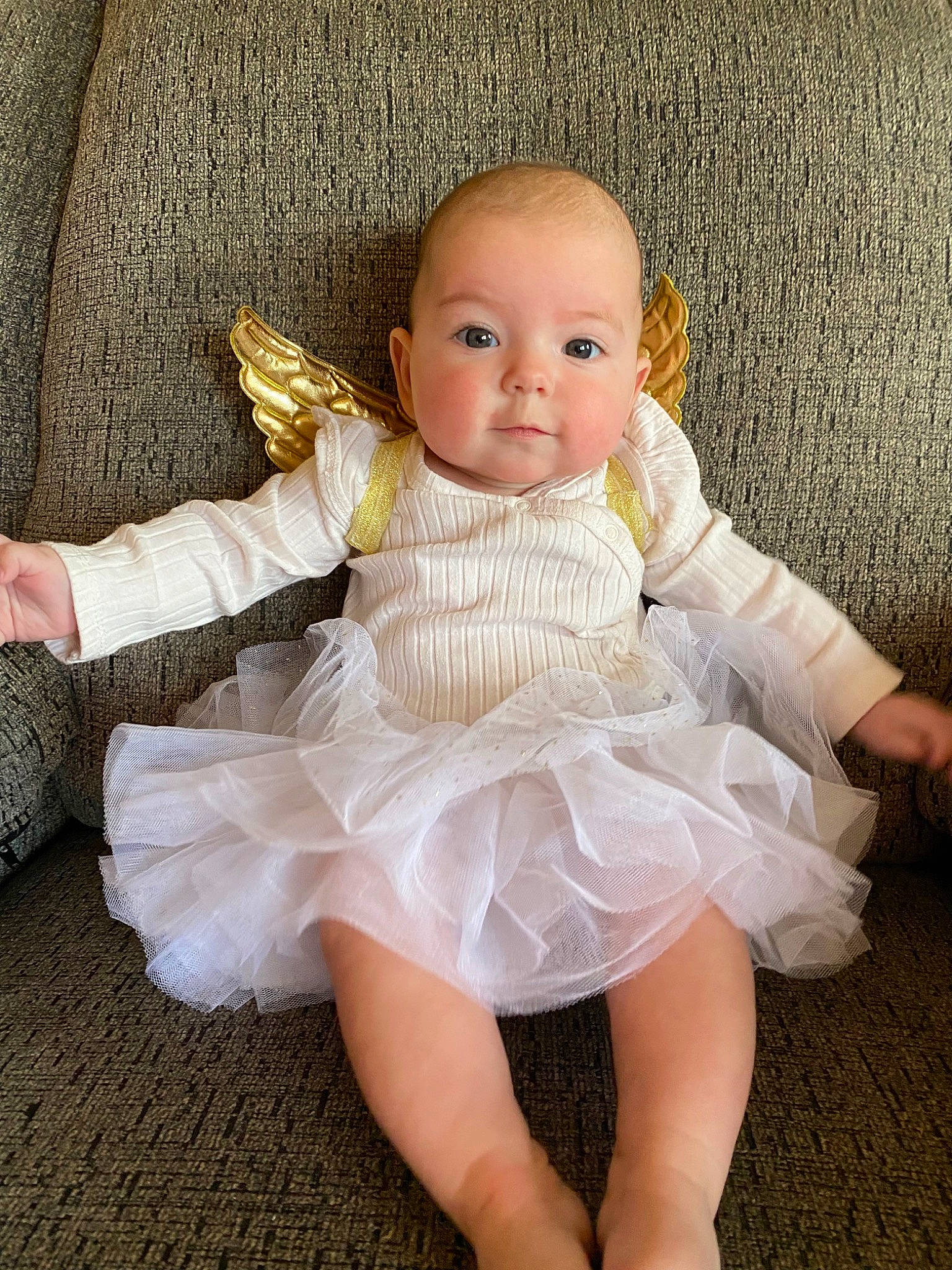 Charleigh is registered to the contest to win money with this photo: baby_toddler_clothing, beauty, bridal_accessory, child, day_dress, dress, embellishment, eye, finger, hand, headgear, headpiece, iris, one_piece_garment, person, pink, ruffle, skin, sleeve, textile