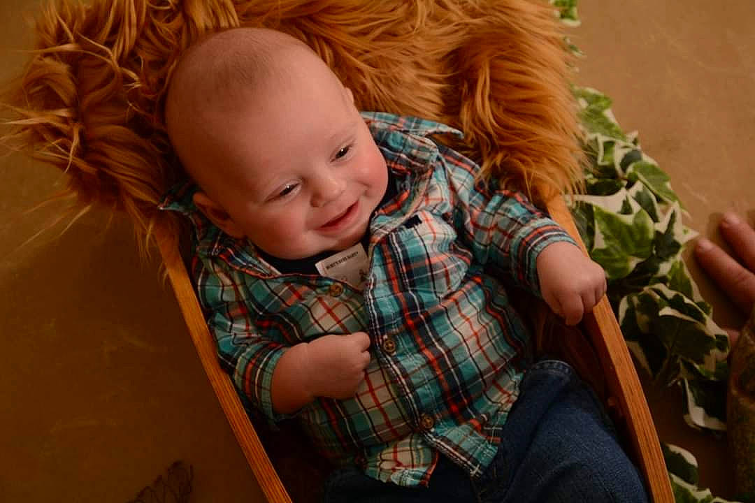 Jaxson joined the competition — help win amazing prizes! baby, cheek, child, design, hair, nose, pattern, person, plaid, portrait, sitting, smile, tartan, textile, toddler