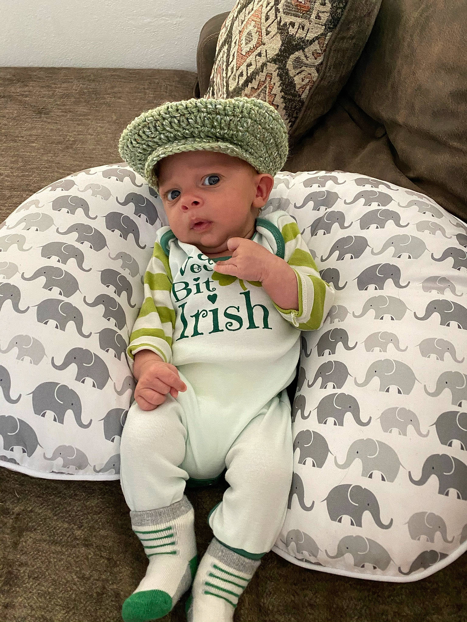 Matteo joined the competition — help win amazing prizes! baby, baby_toddler_clothing, cap, comfort, costume_hat, couch, fashion_accessory, fedora, happy, hat, headwear, human_leg, leg, linens, pattern, person, sitting, sleeve, sock, sun_hat