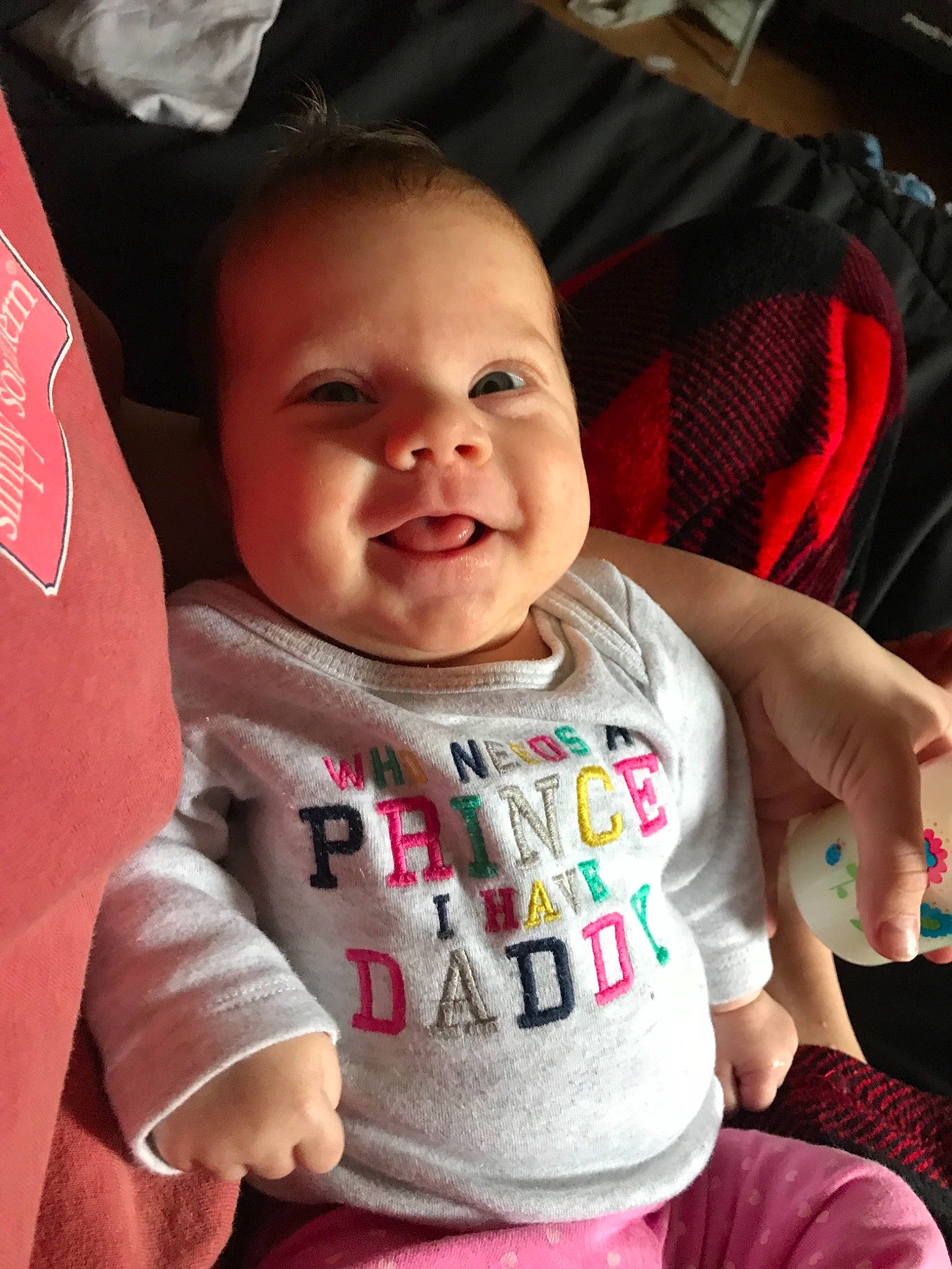 Savanah is registered to the contest to win money with this photo: baby, car_seat, cheek, child, facial_expression, fun, person, pink, product, sitting, skin, smile, toddler, vacation