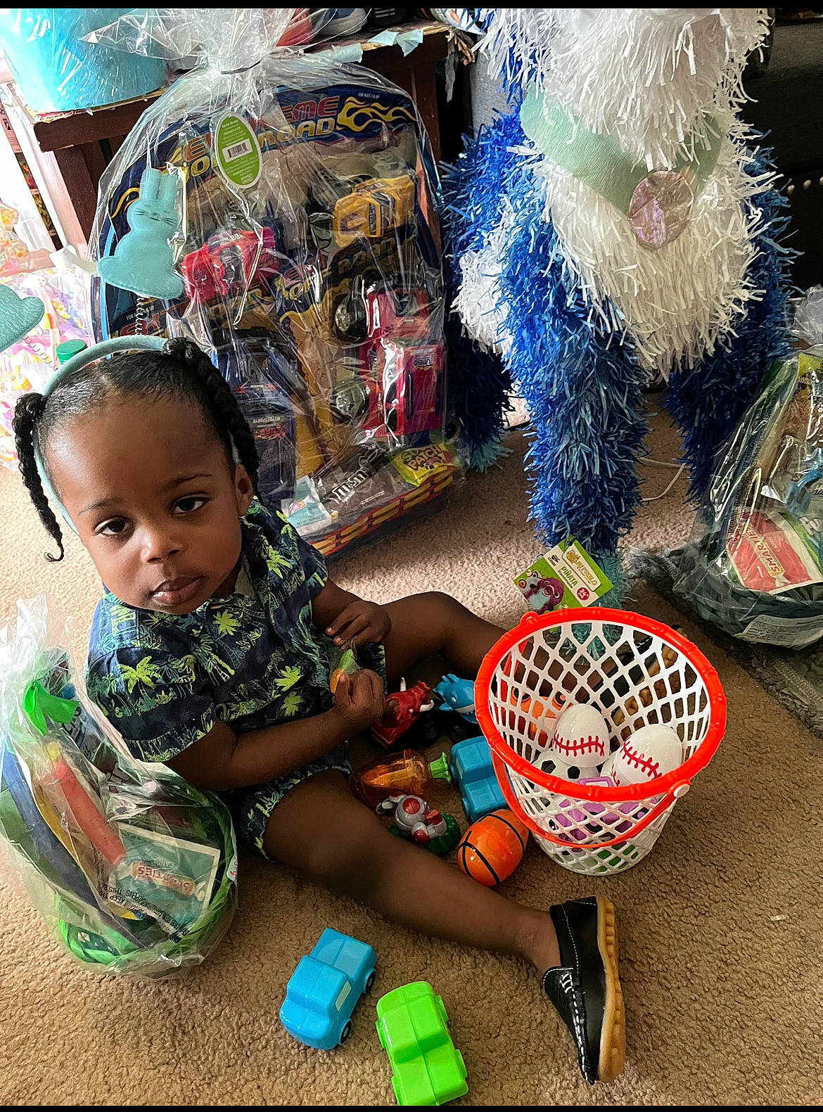 Kayden is registered to the contest to win money with this photo: art, baby, basket, child, event, fashion_accessory, fun, fur, happy, holiday, party_supply, pattern, person, play, product, sandal, sitting, snapshot, toddler, tradition