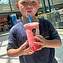 Nolan joined the competition — help win amazing prizes! child, boy, bubble_tea, drink, straw, shopping_mall, indoor, casual_clothing, short_hair, sunlight, bright, happy, beverage, pink_drink, holding, portrait, young, person, leisure, refreshment