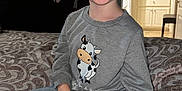 Nolan joined the competition — help win amazing prizes! child, boy, glasses, smiling, sitting, bed, bedspread, clothing, indoor, jeans, sweatshirt, pattern, furniture, mirror, cabinet, doorway, happy, portrait, cute, novelty