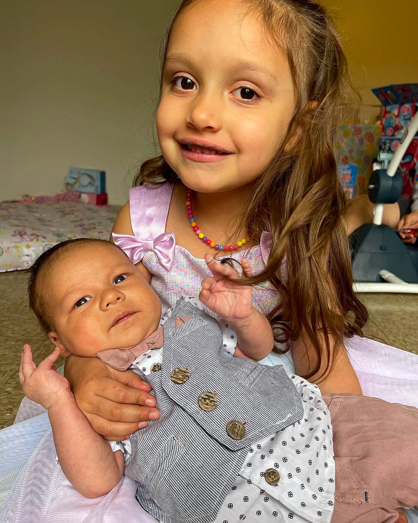 Emilia joined the competition — help win amazing prizes! baby_toddler_clothing, cheek, chin, dress, eyebrow, face, facial_expression, gesture, hair, hairstyle, hand, happy, head, human_body, iris, joy, lip, mouth, nose, person