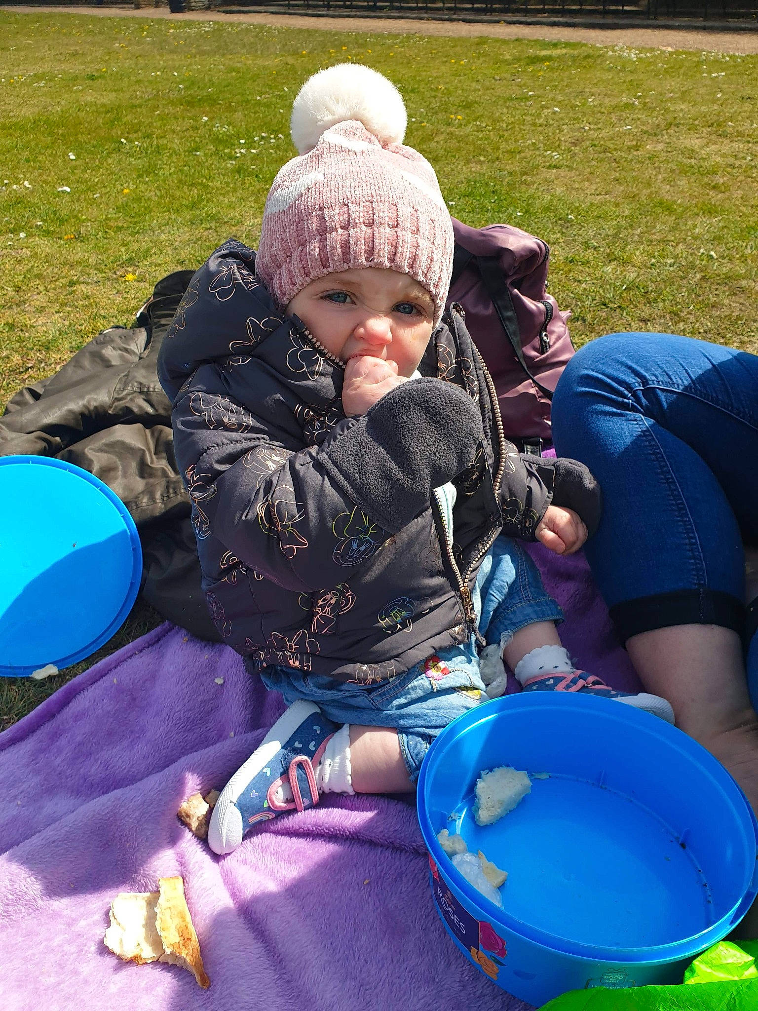 Molly is registered to the contest to win money with this photo: baby, baby_toddler_clothing, blue, child, electric_blue, fun, grass, headwear, lap, leisure, mammal, people_in_nature, person, personal_protective_equipment, play, recreation, sitting, toddler, vacation, vertebrate