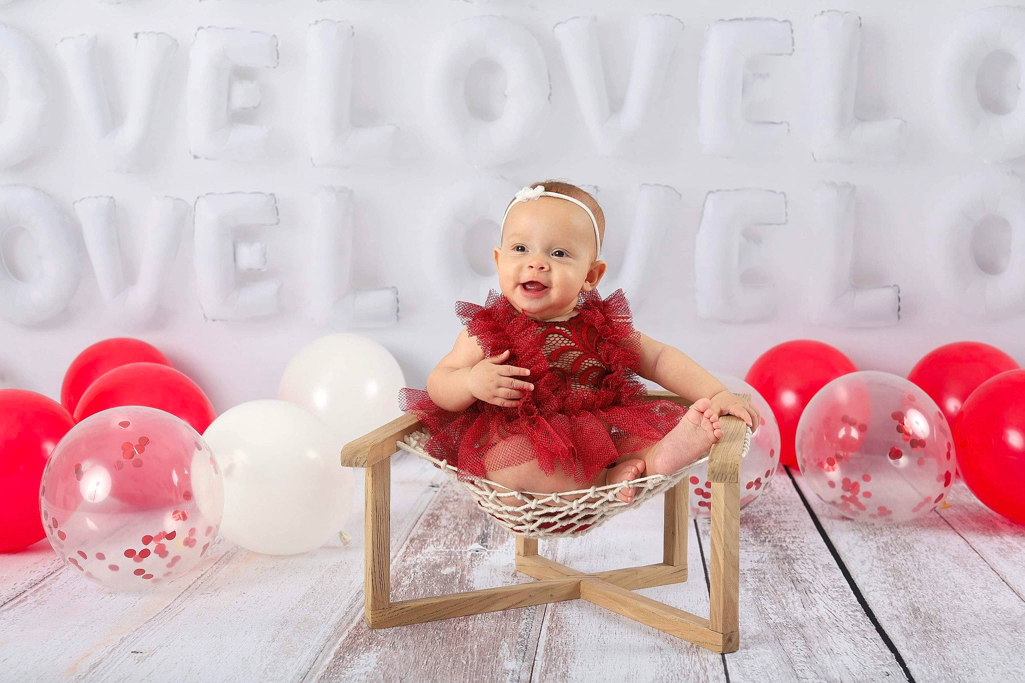 Aryiah joined the competition — help win amazing prizes! baby, baby_toddler_clothing, balloon, chair, child, comfort, event, fun, happy, magenta, party_supply, pattern, peach, person, pink, portrait_photography, red, room, sitting, skin