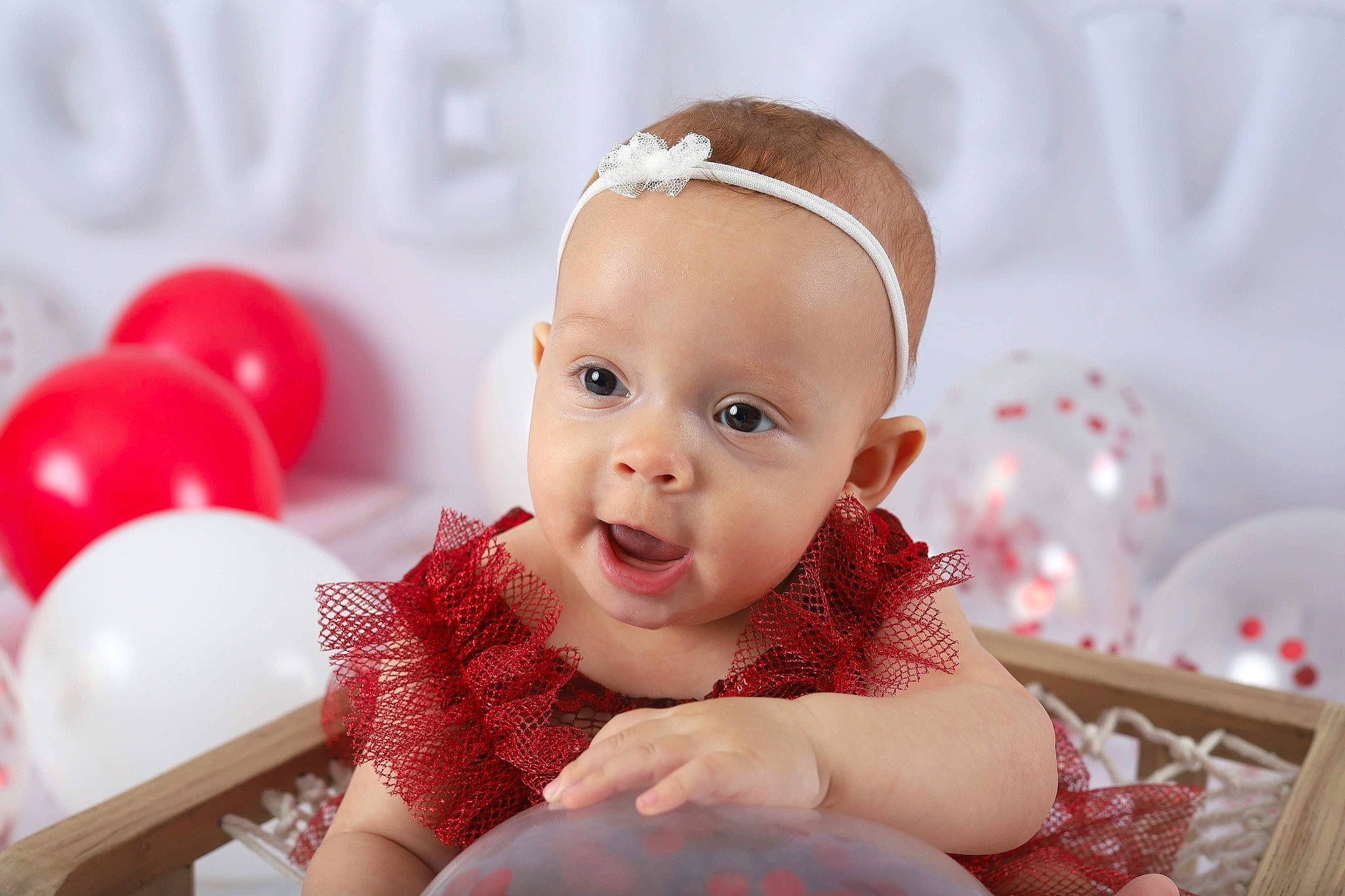 Aryiah is registered to the contest to win money with this photo: baby, baby_toddler_clothing, balloon, cheek, child, event, facial_expression, fashion_accessory, fun, hair_accessory, happy, headband, headpiece, person, pink, portrait_photography, room, sitting, skin, sleeve