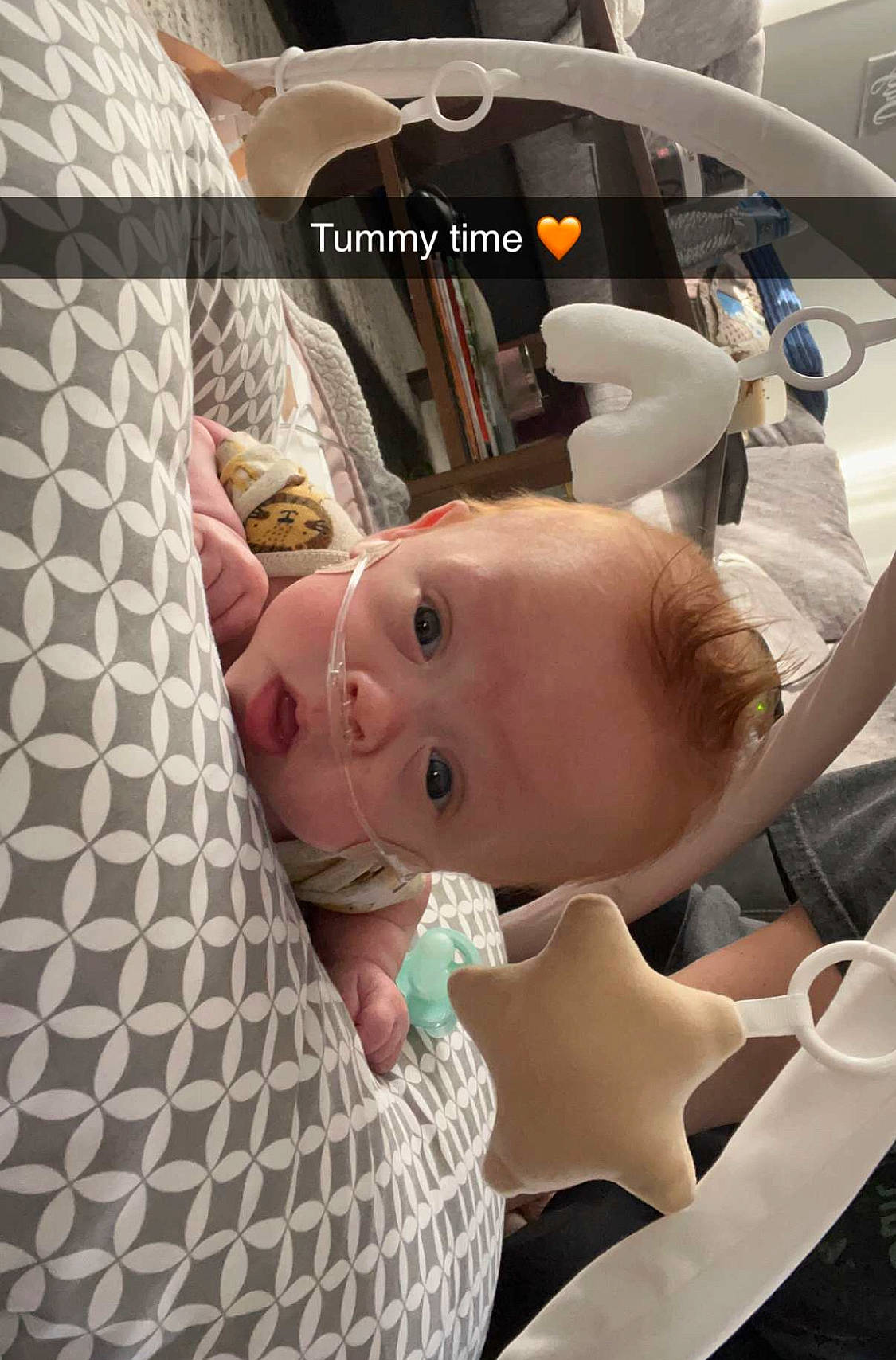 Lennon is registered to the contest to win money with this photo: automotive_design, baby, baby_products, baby_safety, baby_toddler_clothing, car_seat, chest, child, comfort, linens, pattern, person, product, room, sitting, skin, toddler