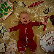 Westin joined the competition — help win amazing prizes! baby, pajamas, cookie_cutters, cookies, baking_tools, whisk, rolling_pin, holiday_plate, flour, happy, smiling, floor, festive, red_clothing, chocolate_cookies, icing, gingerbread_wrappers, infant, indoors, celebration