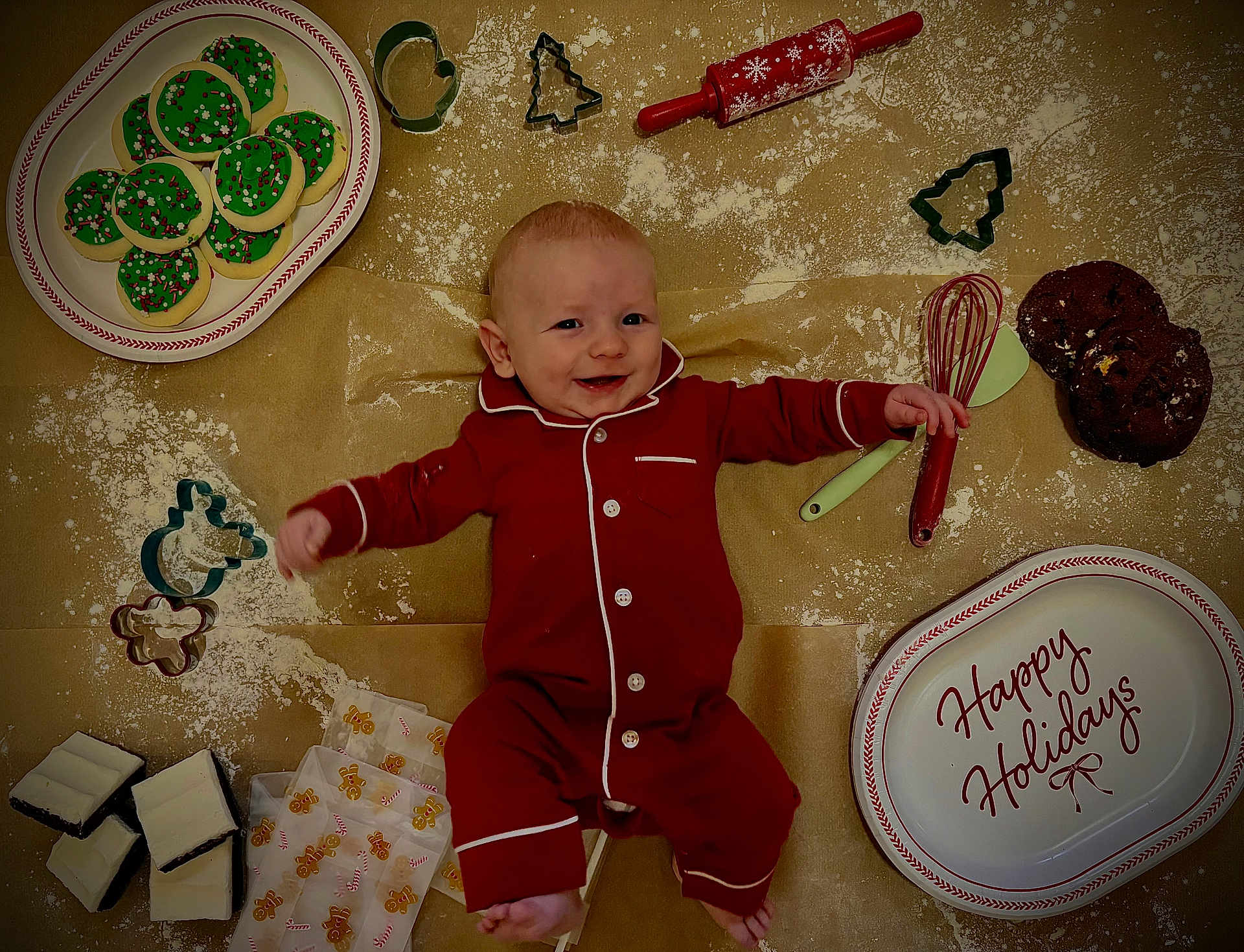 Westin joined the competition — help win amazing prizes! baby, pajamas, cookie_cutters, cookies, baking_tools, whisk, rolling_pin, holiday_plate, flour, happy, smiling, floor, festive, red_clothing, chocolate_cookies, icing, gingerbread_wrappers, infant, indoors, celebration