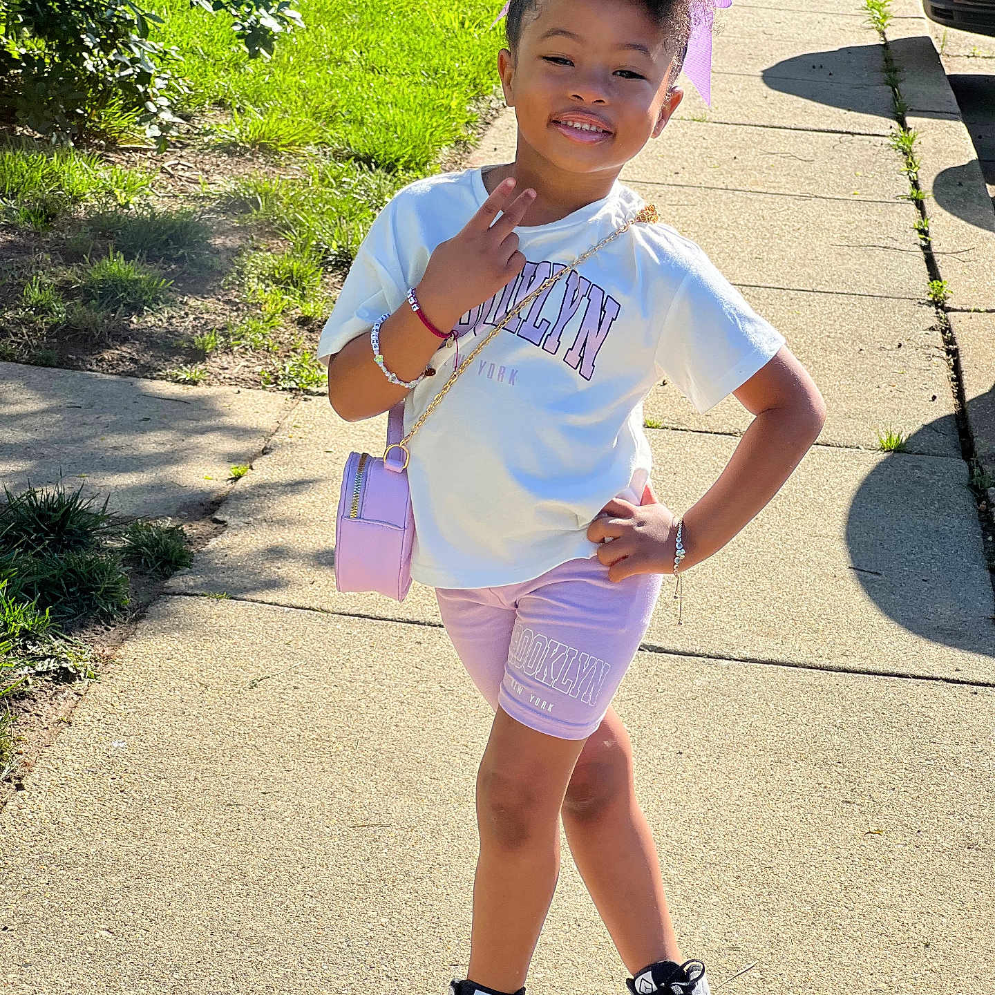 Zoie is registered to the contest to win money with this photo: accessories, bracelet, child, clothing, face, female, footwear, girl, hair, head, jewelry, path, person, photography, portrait, shoe, shorts, sleeve, sneaker, standing