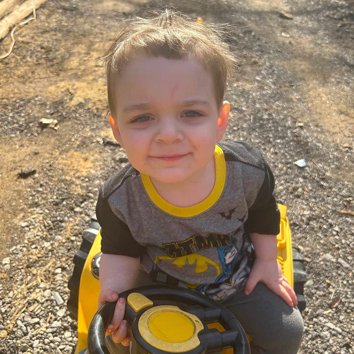 Colten is registered to the contest to win money with this photo: boy, child, clothing, face, grass, head, male, nature, outdoors, pants, park, person, photography, plant, playarea, portrait, soil, t_shirt, transportation, vegetation