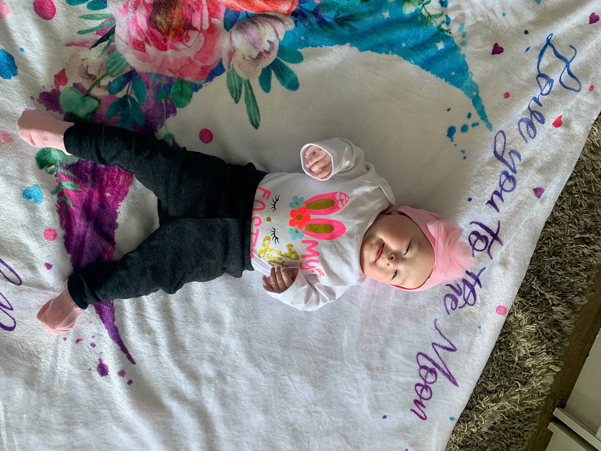Addisyn joined the competition — help win amazing prizes! baby, baby_products, baby_toddler_clothing, child, comfort, facial_expression, happy, headwear, linens, magenta, pattern, person, pink, plant, product, room, sleeve, textile, toddler, tree