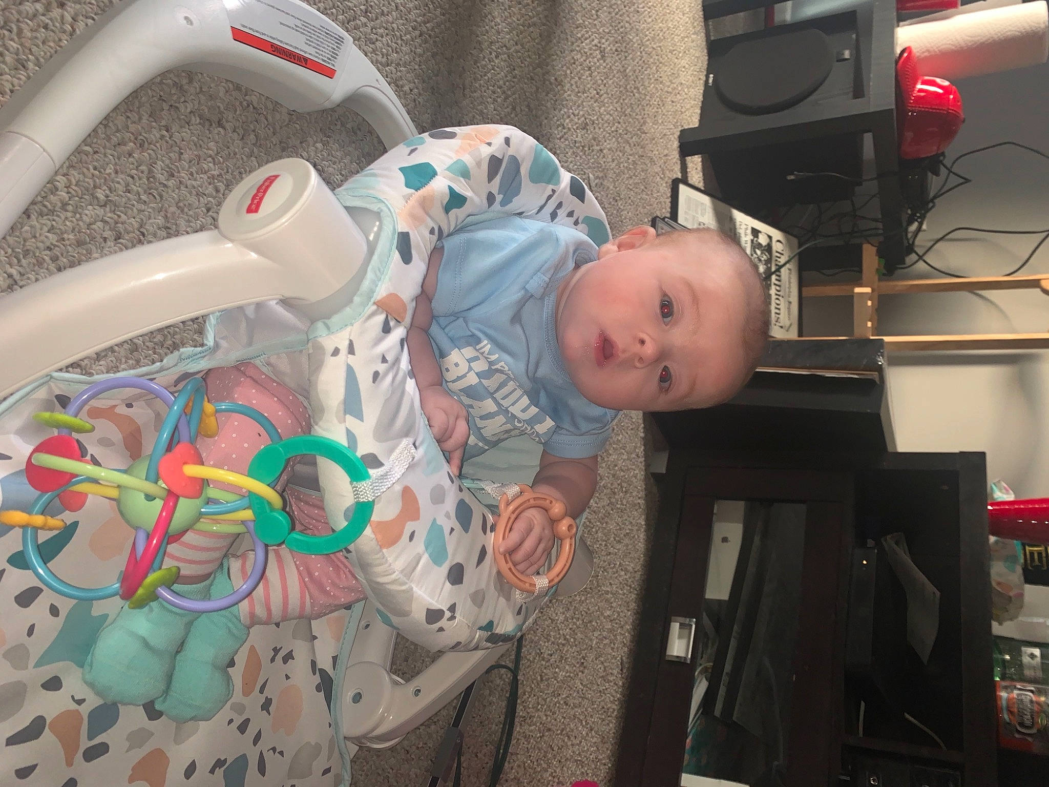 Addisyn is registered to the contest to win money with this photo: audio_equipment, auto_part, automotive_exterior, automotive_lighting, baby, baby_carriage, baby_products, baby_toddler_clothing, child, comfort, fun, helmet, person, personal_protective_equipment, plastic, room, sitting, t_shirt, toddler, toy