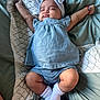 baby, sleeping, blue_outfit, headband, bow, arm_stretch, bed, blanket, sock, infant, cute, peaceful, child, rest, soft, comfort, pajamas, cozy, indoors, person