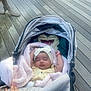 Hazel joined the competition — help win amazing prizes! baby, sleeping, stroller, blanket, headband, bow, plush_toy, snorlax, hand, wooden_deck, outdoor, child, infant, cute, peaceful, soft_texture, yellow_dress, person, cozy, resting