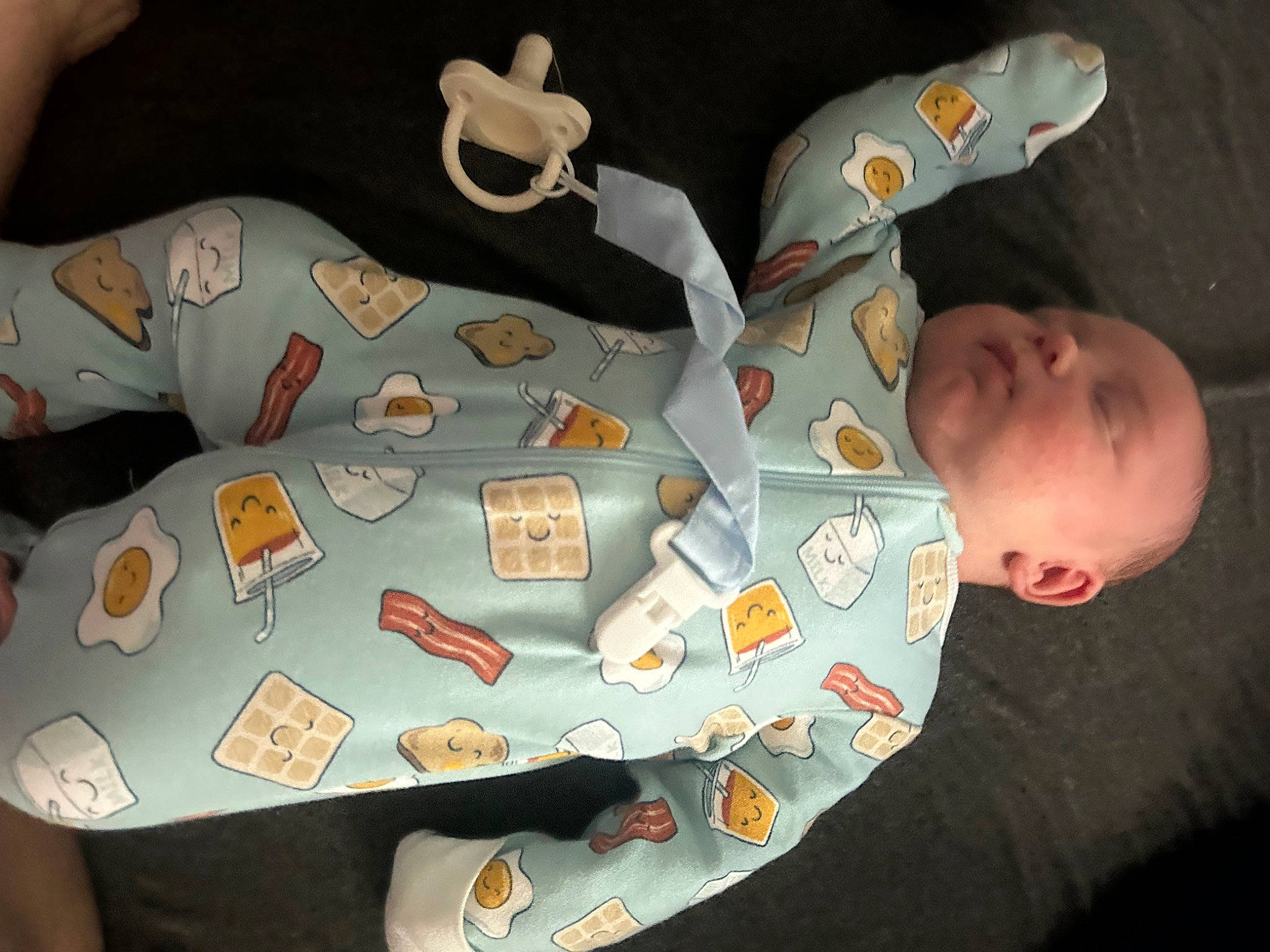 Lane is registered to the contest to win money with this photo: airplane, art, baby, baby_products, baby_toddler_clothing, baby_toys, camouflage, carmine, child, comfort, fashion_accessory, finger, linens, military_camouflage, pattern, person, product, sleeve, textile, toddler